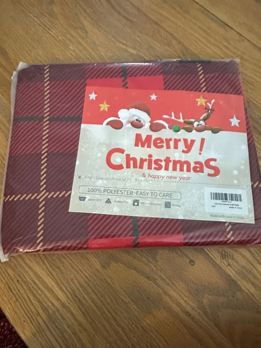 New In Packaging Festive Red Plaid Holiday Tablecloth, Poinsettia Border 60x120*
